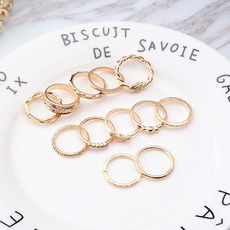 Geometric Circle Gold Rings Set featuring stackable alloy rings in modern geometry style, displayed on a white plate with decorative text.